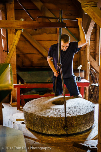Moving a very heavy mill stone made somewhat easier with the use of a crane.  Balmoral Grist Mill Museum in Balmoral Mills, Nova Scotia