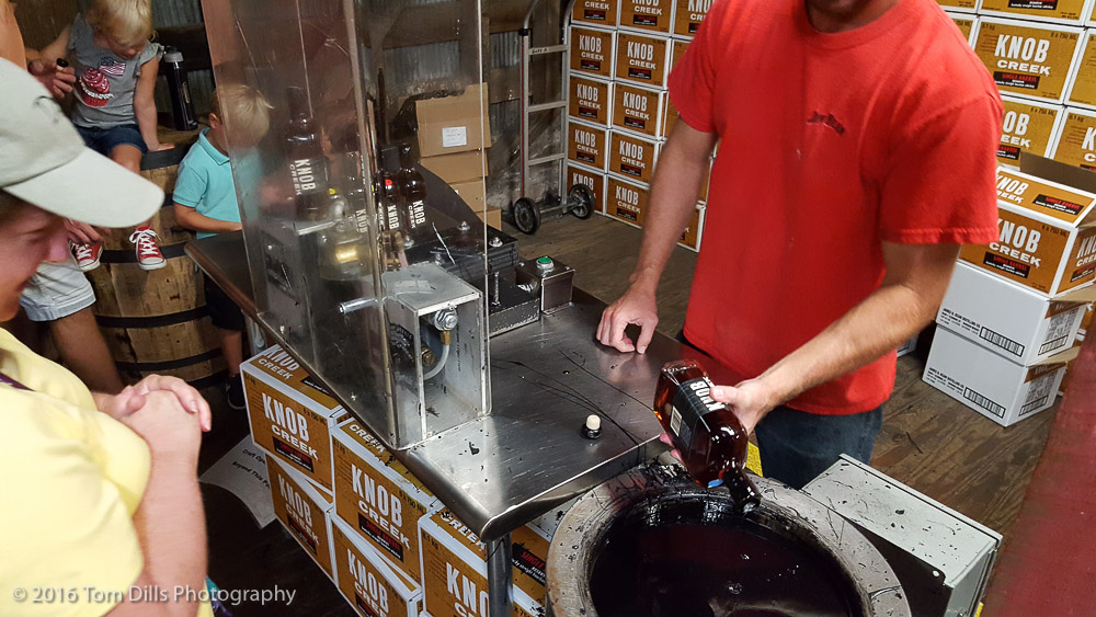 Hand dipping the wax seal on a "souvenir" bottle of Knob Creek at Jim Beam Distillery, Clermont, Kentucky